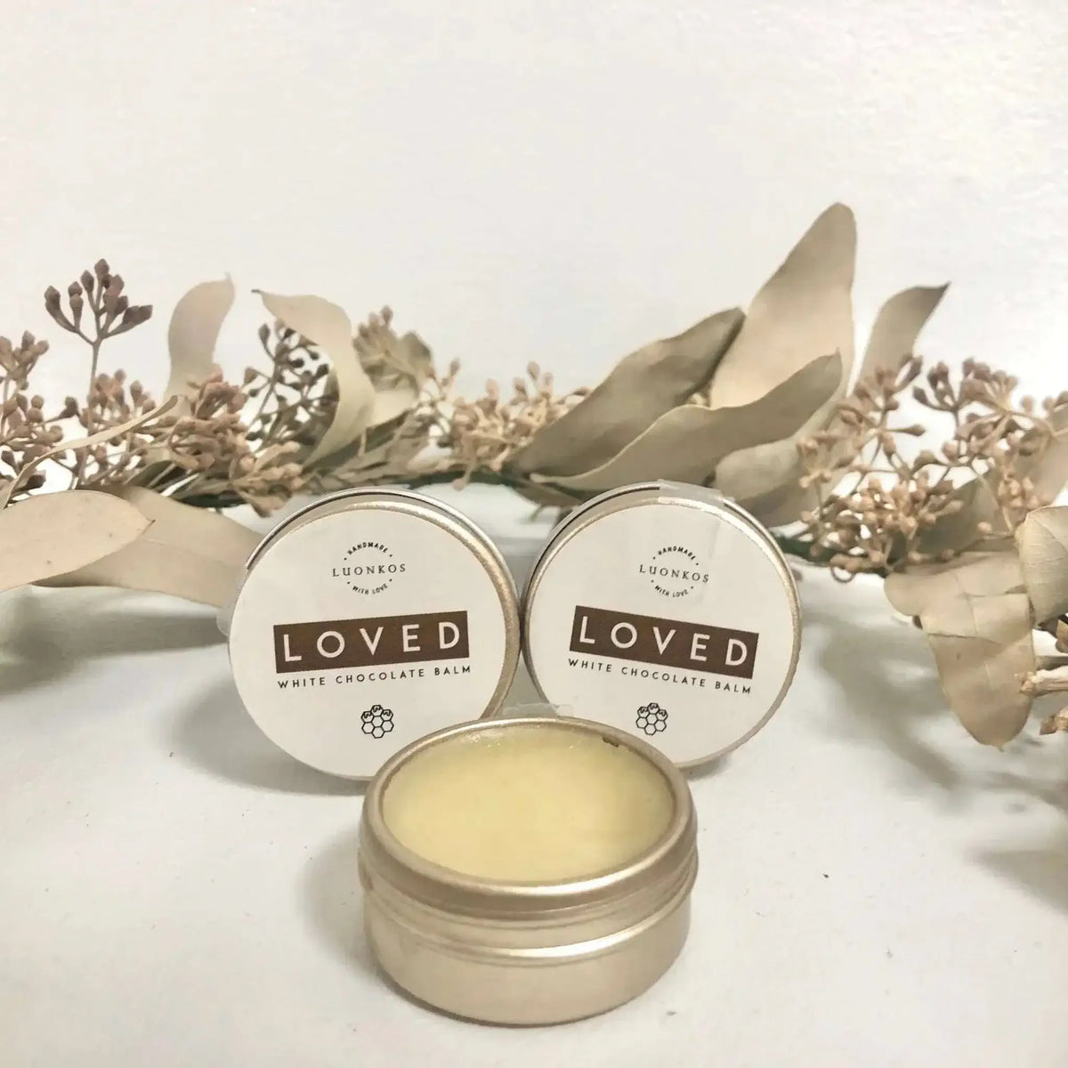 Loved hoitava balsami white chocolate balm in small tins for lips and skin care packed in a 2-pack set