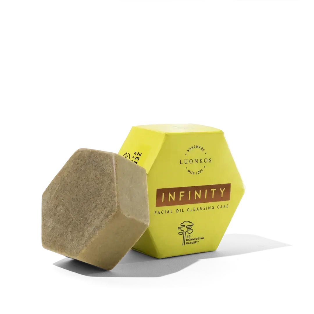 Infinity facial oil cleansing cake in hexagonal packaging, natural vegan puhdisöljy for gentle makeup and impurity removal.