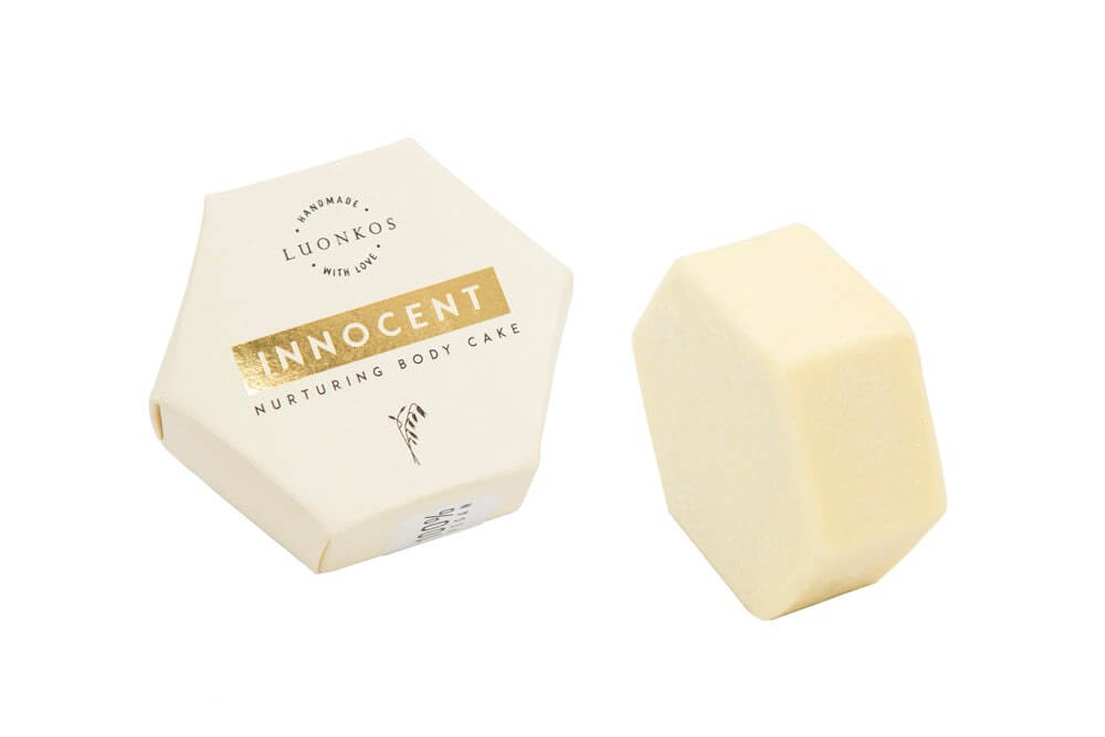 Innocent nurturing body oil cake bar with natural ingredients for moisturizing and protecting sensitive skin.