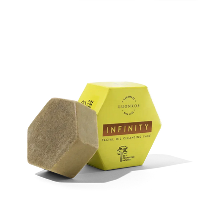 Infinity facial oil cleansing cake in hexagonal packaging, natural vegan puhdisöljy for gentle makeup and impurity removal.